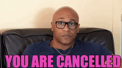 man clicking the power button on a TV remote. You are canceled!